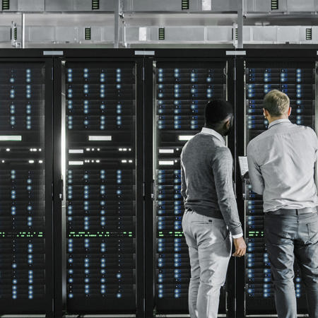 Data centre workers looking at equipment