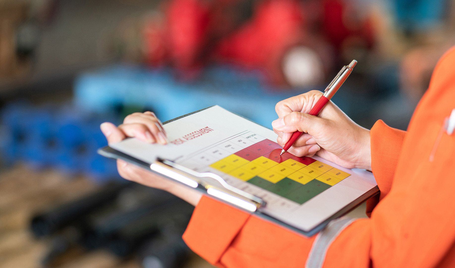 A worker reviewing a risk assessment