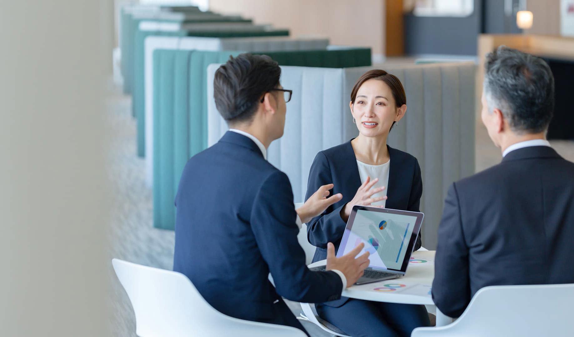 Three colleagues in a business meeting