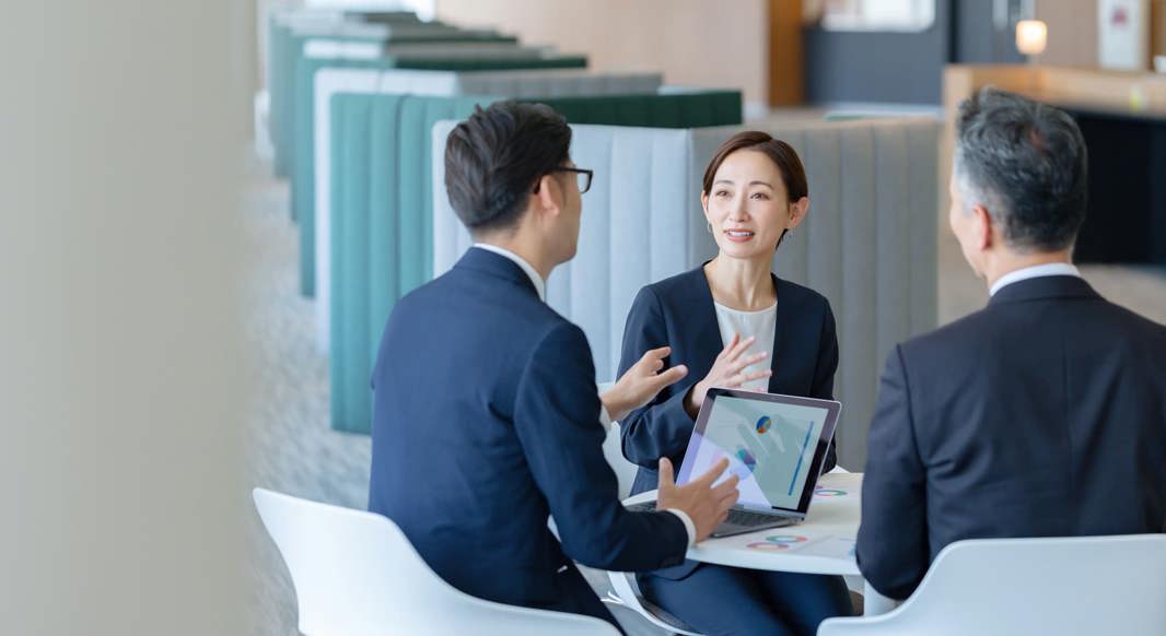 Three colleagues in a business meeting